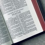 A King James Bible open to Isaiah.